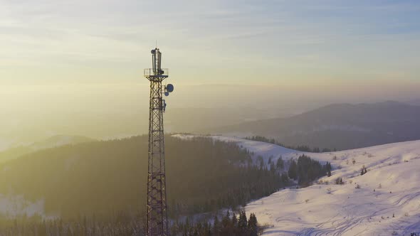 Flying Over Radio Communications Tower Mountain Snow Covered Winter Landscape