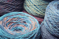Round skeins of organic multi-coloured lambswool yarn. - PhotoDune Item for Sale