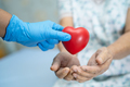 Doctor give red heart to Asian senior woman patient, healthy strong medical. - PhotoDune Item for Sale