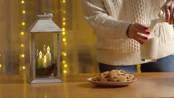 Crop Woman Preparing Milk Cookies Santa Claus