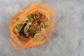 Food waste in the bag. Cutting vegetables and fruits for garbage - PhotoDune Item for Sale