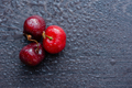 Ripe cherries on a dark wooden background. - PhotoDune Item for Sale