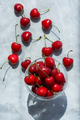 Cherry in a glass glass on a gray background top view. - PhotoDune Item for Sale