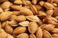 Background of unpeeled almonds in the shell. - PhotoDune Item for Sale