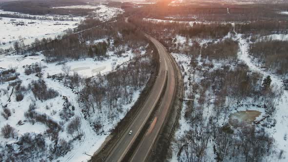 Perfect Winter Landscape with a Road at Sunset Aerial View