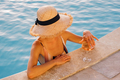 Portrait of laughing beautiful woman in swimwear relaxing in swimming spa pool - PhotoDune Item for Sale
