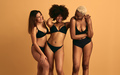 Happy multiracial women in underwear smiling in studio - PhotoDune Item for Sale