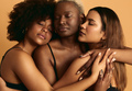 Multiracial girlfriends cuddling in studio - PhotoDune Item for Sale