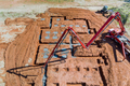 Concrete is being pumped into the foundation of the house by a construction worker - PhotoDune Item for Sale