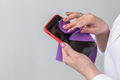 Germs elimination. Cleaning the smartphone screen with fiber cloth from dirt dust and other external - PhotoDune Item for Sale