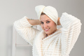 Woman make head towel turban on head and wears bathrobe - spa and body skin care concept - PhotoDune Item for Sale