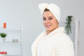 Woman make head towel turban on head and wears bathrobe - spa and body skin care concept - PhotoDune Item for Sale