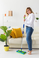 Cleaning woman holding a squeegee mop - house cleaning concept - PhotoDune Item for Sale
