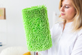 Portrait of housewife woman holds mop pad - cleaning concept - PhotoDune Item for Sale