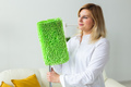 Cleaning woman holding a squeegee mop - house cleaning concept - PhotoDune Item for Sale