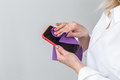 Closeup woman hands cleaning the smartphone screen with a fiber cloth from dirt dust and virus - PhotoDune Item for Sale