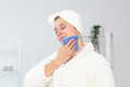 Excited joyful young woman wrapped head in towel holding dry brush shower sponge and doing spa - PhotoDune Item for Sale