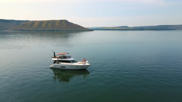 Aerial Shot Luxurious Yachts Near the Rocky Shore