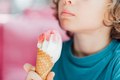 Closeup portrait of boy eating cone ice cream. Child licking ice cream. - PhotoDune Item for Sale