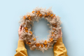 Woman holding in hands Thanksgiving wreath. - PhotoDune Item for Sale