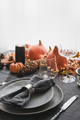 Halloween and Thanksgiving day dinner decorated fallen leaves, pumpkins, spices, grey plate. - PhotoDune Item for Sale