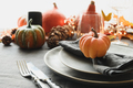 Halloween and Thanksgiving day dinner decorated fallen leaves, pumpkins, spices, grey plate. - PhotoDune Item for Sale