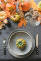 Thanksgiving day table setting with empty plate decorated fallen leaves, pumpkins. - PhotoDune Item for Sale