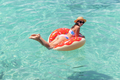 Beautiful woman with inflatable donut in sea - PhotoDune Item for Sale
