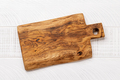 Wooden cutting board on white kitchen table - PhotoDune Item for Sale