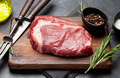 Raw ribeye steak on cutting board - PhotoDune Item for Sale