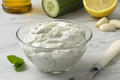 Bowl with fresh made traditional Greek tzatziki close up - PhotoDune Item for Sale