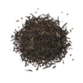 Heap of Nonaipara Assam dried tea leaves close up on white background - PhotoDune Item for Sale