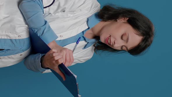 Vertical Video Female Scientist Taking Notes on Clipboard Documents