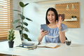 Cheerful asian teen girl waving hand enjoying online virtual chat video call on mobile phone. - PhotoDune Item for Sale
