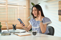 Pretty asian teen girl waving hand enjoying online virtual chat video call on mobile phone. - PhotoDune Item for Sale