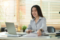 Beautiful asian female financial advisor using laptop  giving internet consultation to customer. - PhotoDune Item for Sale