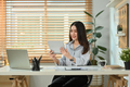 Portrait of beautiful asian woman using digital tablet at working desk in home office. - PhotoDune Item for Sale