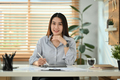 Shot of successful asian female small business entrepreneur using digital tablet. - PhotoDune Item for Sale