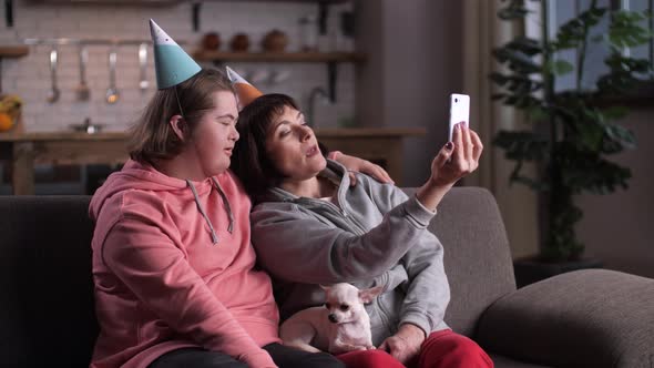 Teen Girl Down with Mom Posing for Birthday Selfie
