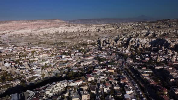 Uchisar Town Landscape Against a Mountain Background Filmed By Drone at Summer Day