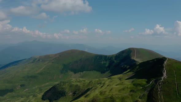 Aerial Drone View. Green Mountains Without Trees, on a Background of Blue Sky Svydovets Dragobrat V3