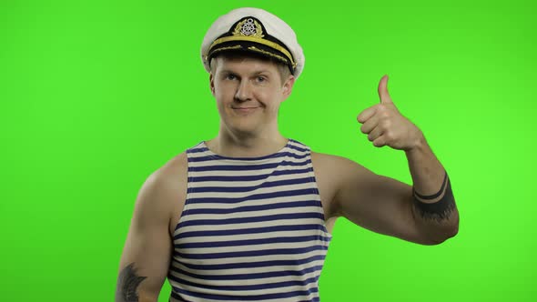 Young Sailor Man Thumbs Up, Looking at Camera. Seaman Guy in Sailor's Vest