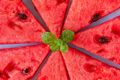 Juicy fresh watermelon pieces with mint leaves in the middle, delicious summer food - PhotoDune Item for Sale