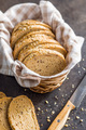 Sliced whole grain bread. Tasty wholegrain pastry with seeds in baket. - PhotoDune Item for Sale
