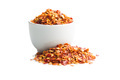 Dry chili pepper flakes in bowl. Crushed red peppers isolated on white background. - PhotoDune Item for Sale
