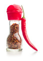 Chili pepper flakes. Crushed red peppers in mill and fresh red peppers isolated on white background. - PhotoDune Item for Sale