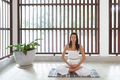 Yoga for the Soul, Meditative Woman in Lotus Pose Practicing Indoors - PhotoDune Item for Sale