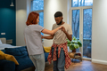 Young diverse couple in love preparing first wedding dance together at home - PhotoDune Item for Sale