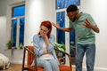 Angry African American man husband abuser yelling at upset crying wife at home - PhotoDune Item for Sale