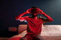 Black man using virtual reality headset at home with neon light, sit on bed at night. VR addiction. - PhotoDune Item for Sale